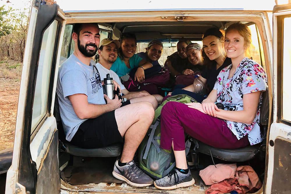 Group crowds into back of van